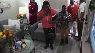 Warrick Dunn Foundation gifts homes to two families