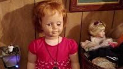 Haunted spirited doll moves eyes watch in video