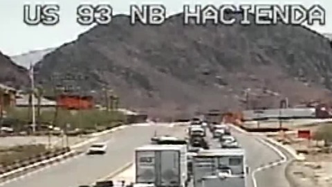 Man threatening to jump closes Interstate 11