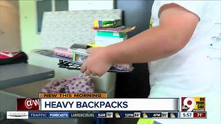 The dangers of your kids' heavy backpacks