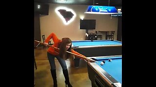 Redhead playing pool