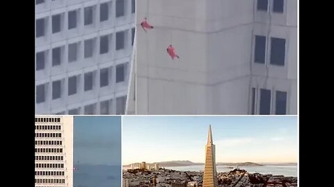 Peak performance! Three members of a dance troupe rappel down the side of iconic 853ft Transamerica