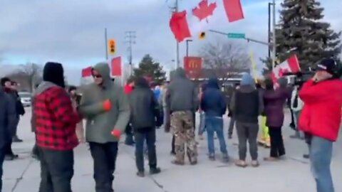 CANADIAN PROTESTORS SING NATIONAL ANTHEM TO POLICE