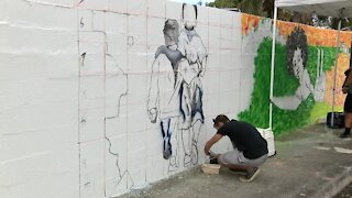 Artists revitalize historic Unity Wall in Lake Worth Beach