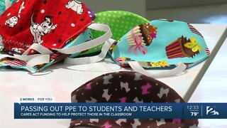 Project Safe Schools: Passing out PPE to students, teachers
