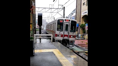 Local Tokyo Train Coming in Fast on Rainy Day at Tokiwadai Station on the Tobu Line in Itabashi