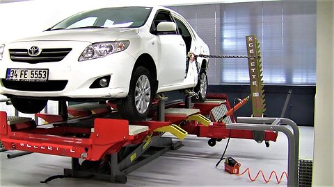 Toyota Corolla ready for Rear Fender pulling repair on Celette Rhone frame machine