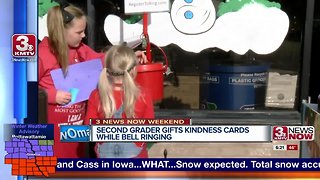 Second grader shares message of kindness while bell-ringing
