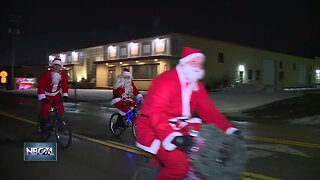 Nearly 60 Santas bike for a cause