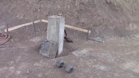 Hand Mixing Concrete In The July Heat