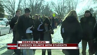 Parents wait in long line to reunite with students after shooting