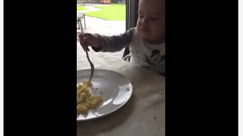 Toddler Takes Real Delight Into Munching Macaroni With Two Forks