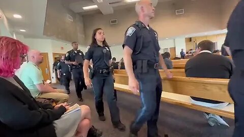 Boston Police officers arriving in Roxbury District Court...