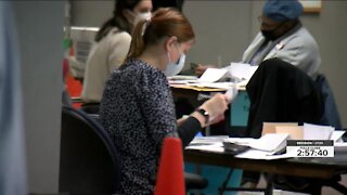 Counting record absentee ballots in Milwaukee