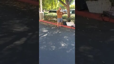Man Plays Violin in Parking lot to Feed Kids