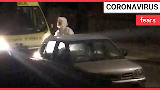 Coronavirus: paramedics in hazmat suits take away a THIRD person in York
