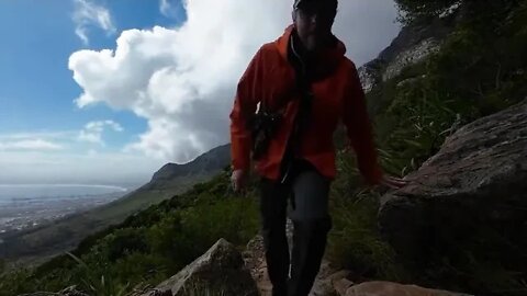 British ~ father ~ and ~ son When we climbed the top of Table Mountain, the most beautiful scenery w