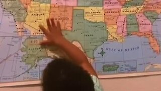 One-year-old has no problem locating different states on a map