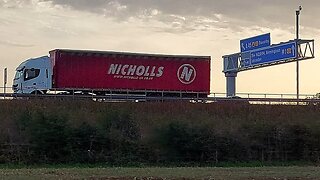 Watching Motorway Traffic From a Field