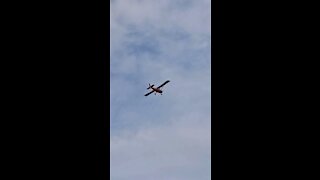 Small plane glides over the lake