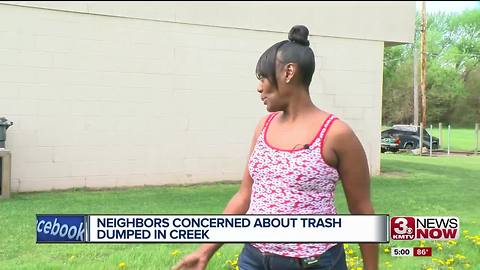 Neighbors concerned about trash dumped in creek