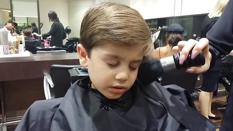 Adorable Kid Decides To Take A Nap During A Haircut