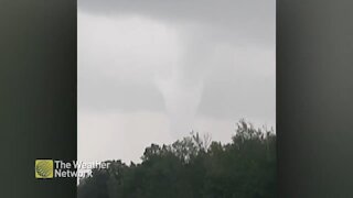 Ominous funnel cloud pops from the stormy skies over Quebec