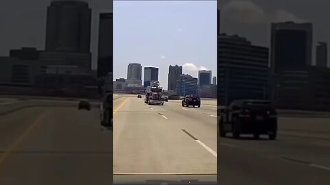 Dash-cam video shows Semi truck towing another truck In Birmingham Alabama.