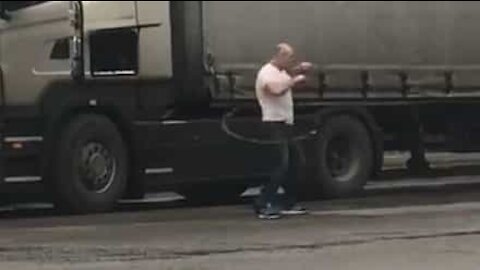 Truck driver does hula hoop as exercise routine