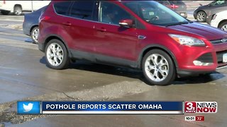 Drivers maneuvering mass potholes on major streets