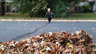 Kids Jumping Into Leaves