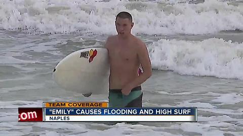 beachgoers brave rough surf