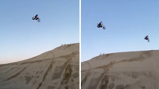 Extreme dirt bike riders soar high above the sky