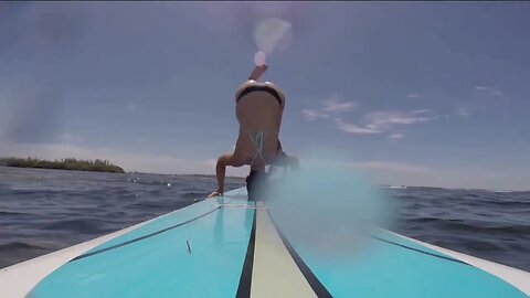 "Mesmerizing Feet & Soles in Action: Bikini Yoga Headstand on Paddleboard"