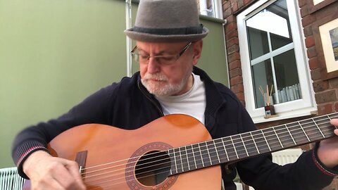 Playing a classical guitar with an oud pick 4.