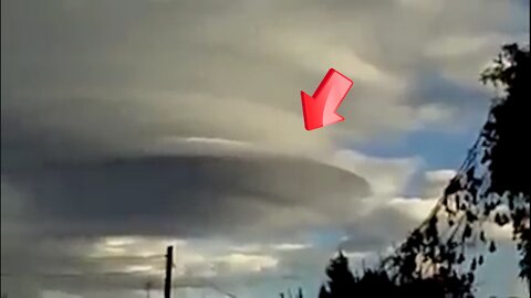 Circular disk-shaped UFO-like object in a large cloudy area [Space]