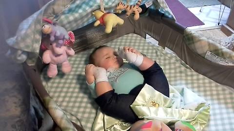 Baby Sleeps With Legs Up In The Air