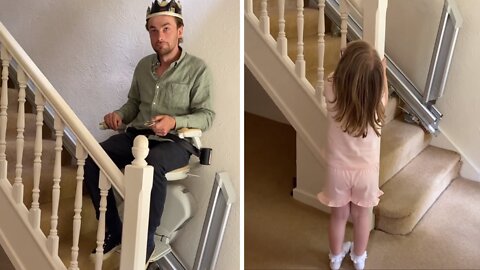 Guy feels like a king as he rides granny's stair lift