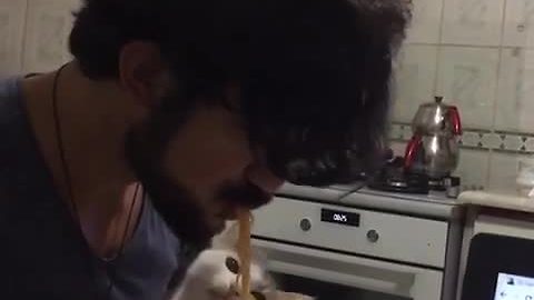 Cat Loves Fishing Spaghetti Out Of Owner’s Mouth