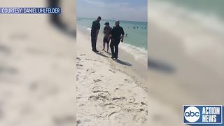 VIDEO: Deputies tell man to leave portion of public beach for trespassing following new beach law