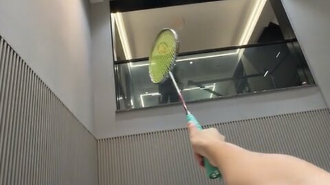 Playing badminton inside the home