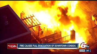 PHOTOS: Roof of condo complex catches fire near downtown Indianapolis