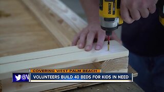 Volunteers build 40 beds for children in need