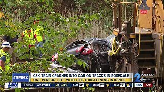 CSX train crashes into car on tracks in Rosedale
