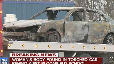 Woman's body found in burned out car