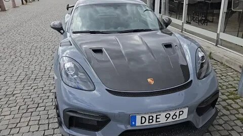 Arctic Grey Porsche Cayman GT4 RS Weissach Package and a yacht in Old Town, Stockholm, Sweden [4k]