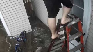 Guy falls off ladder when cleaning gutters