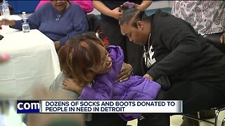 Dozens of socks and boots donated to people in need in Detroit