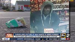 Surveillance picture of man wanted in armed robbery