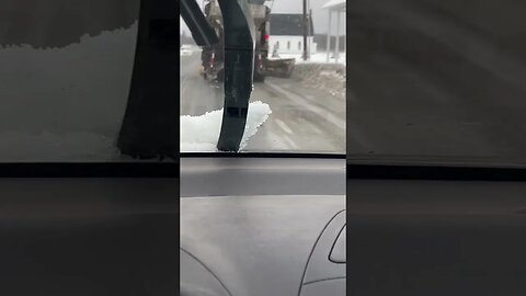 Secondary plow in use on highway snow removal truck